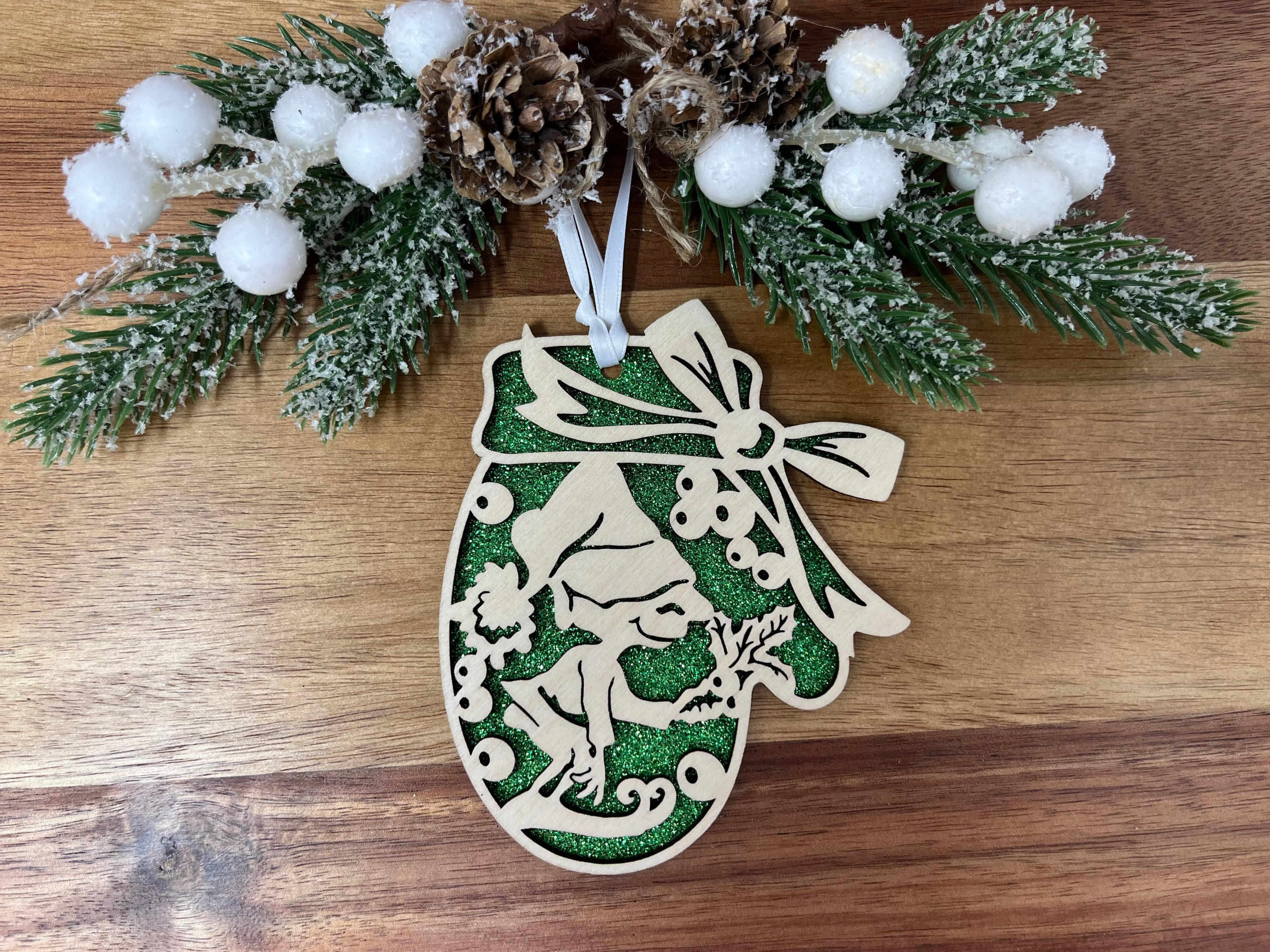 A beautifully crafted Elf Mitten ornament made from premium Baltic Birch wood, featuring intricate laser-cut designs, perfect for holiday gifting.