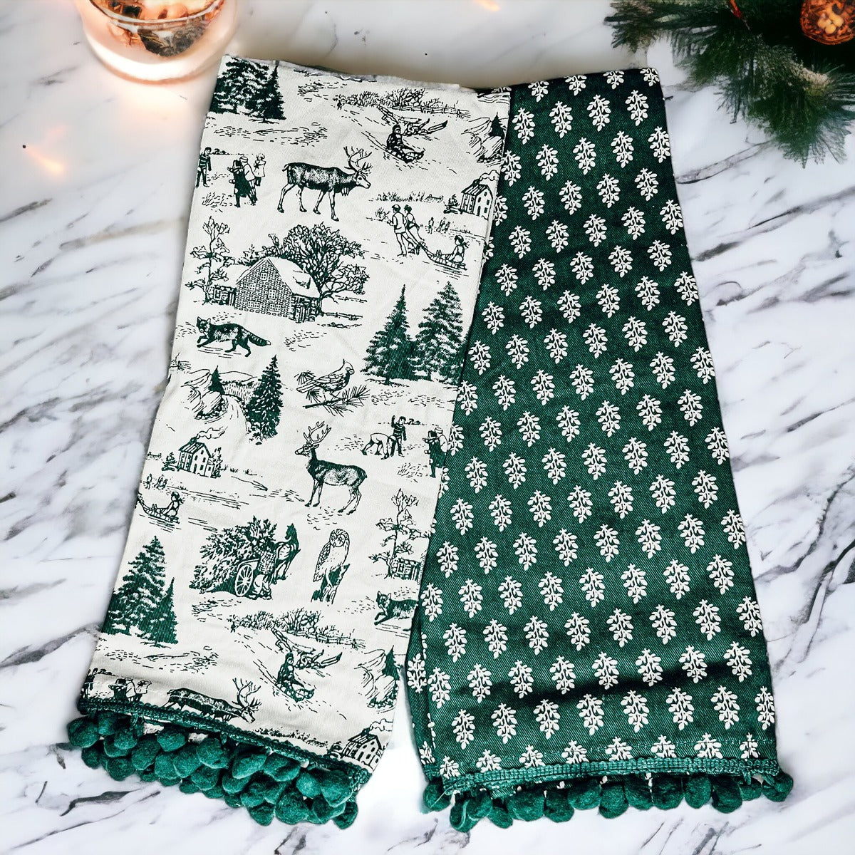 Set of two forest green dish towels with Christmas design, showcasing a classic forest pattern on durable cotton fabric.