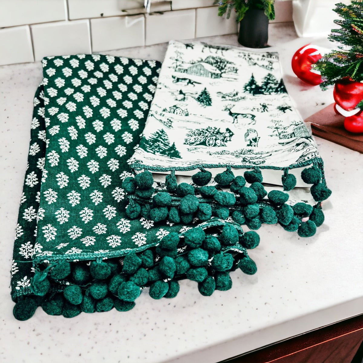 Set of two forest green dish towels with Christmas design, showcasing a classic forest pattern on durable cotton fabric.