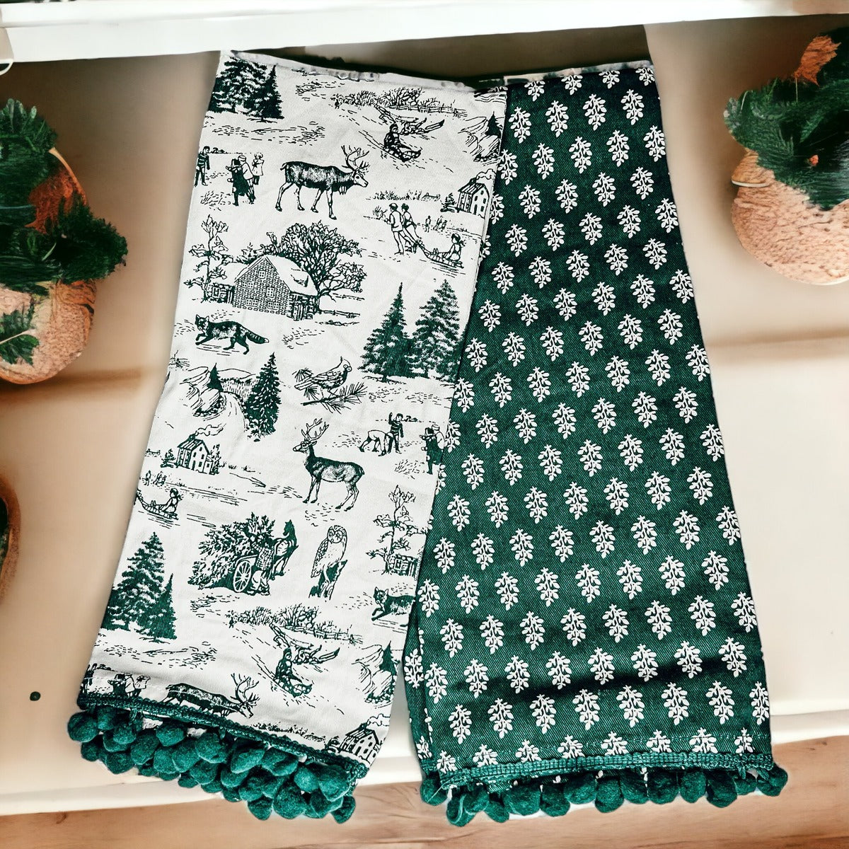 Set of two forest green dish towels with Christmas design, showcasing a classic forest pattern on durable cotton fabric.