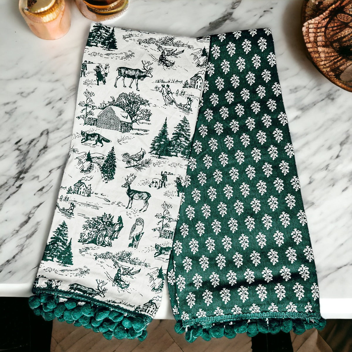 Set of two forest green dish towels with Christmas design, showcasing a classic forest pattern on durable cotton fabric.