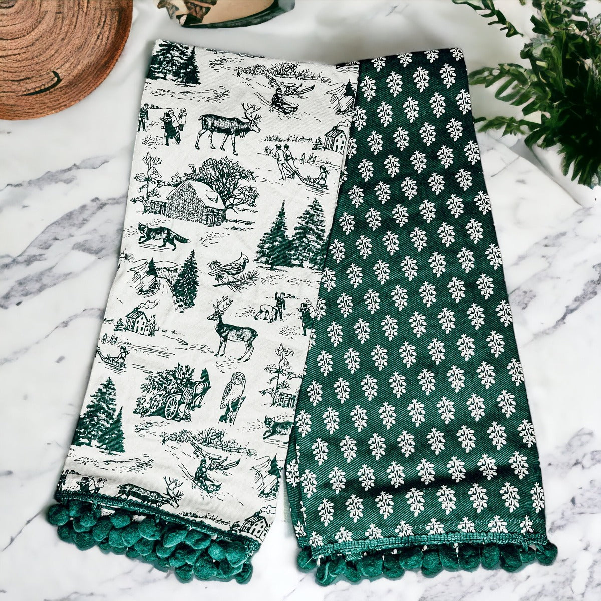 Set of two forest green dish towels with Christmas design, showcasing a classic forest pattern on durable cotton fabric.