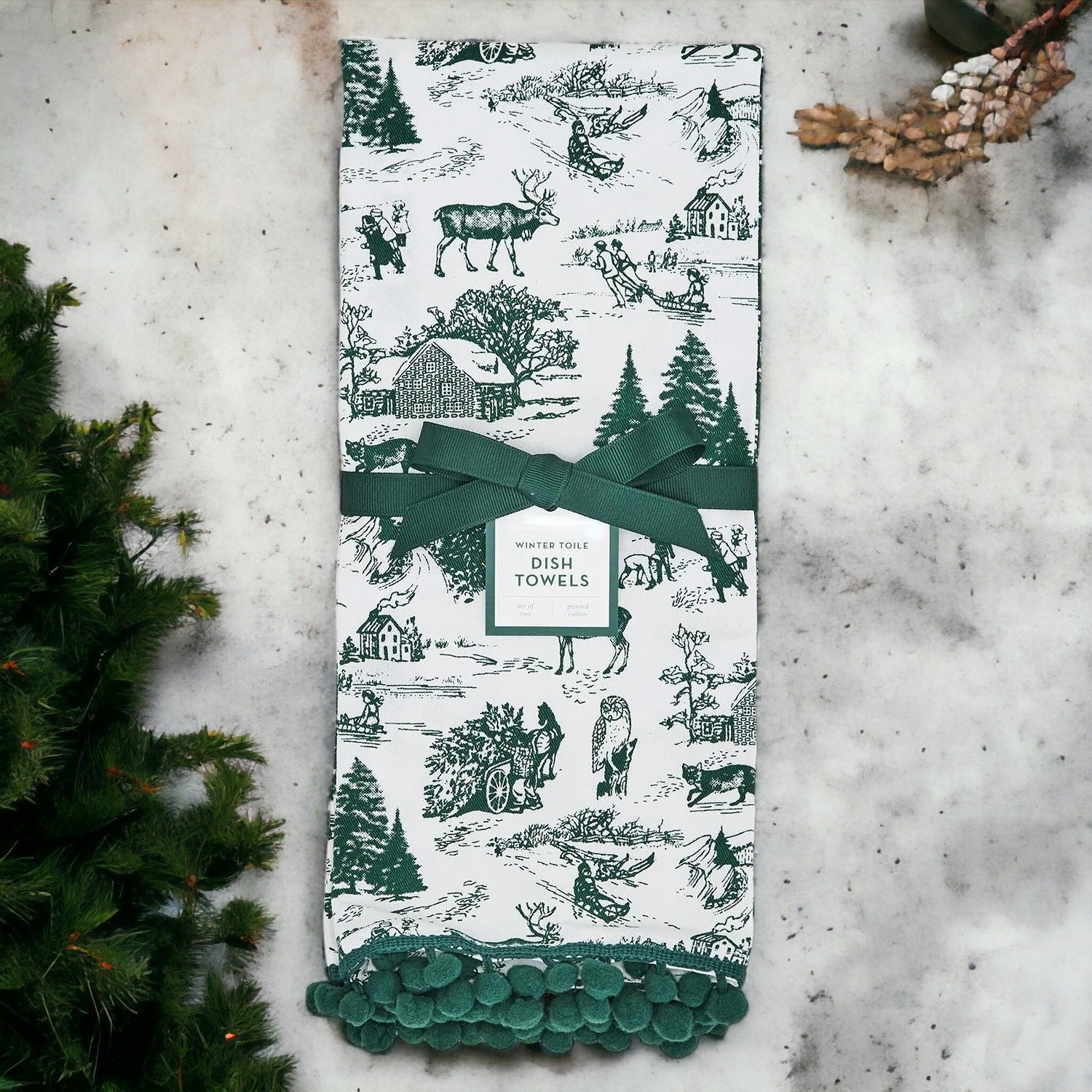 Set of two forest green dish towels with Christmas design, showcasing a classic forest pattern on durable cotton fabric.