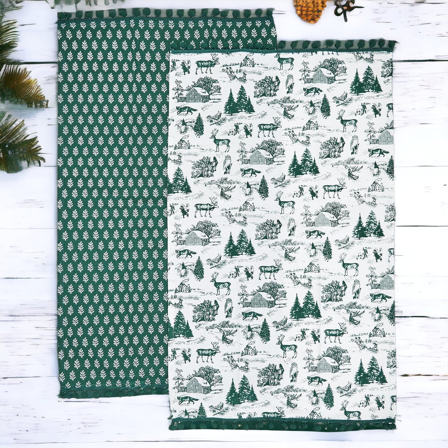 Set of two forest green dish towels with Christmas design, showcasing a classic forest pattern on durable cotton fabric.