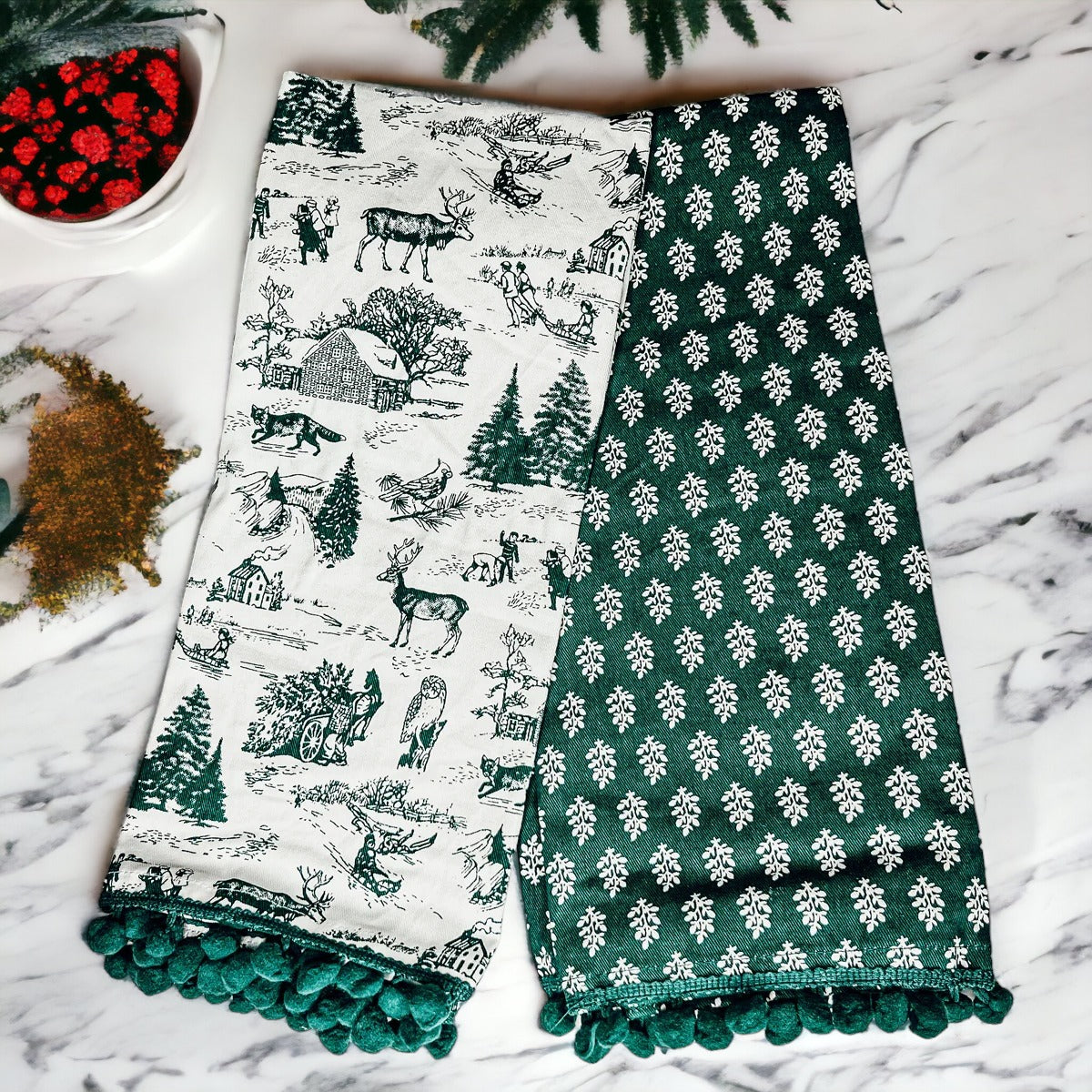 Set of two forest green dish towels with Christmas design, showcasing a classic forest pattern on durable cotton fabric.