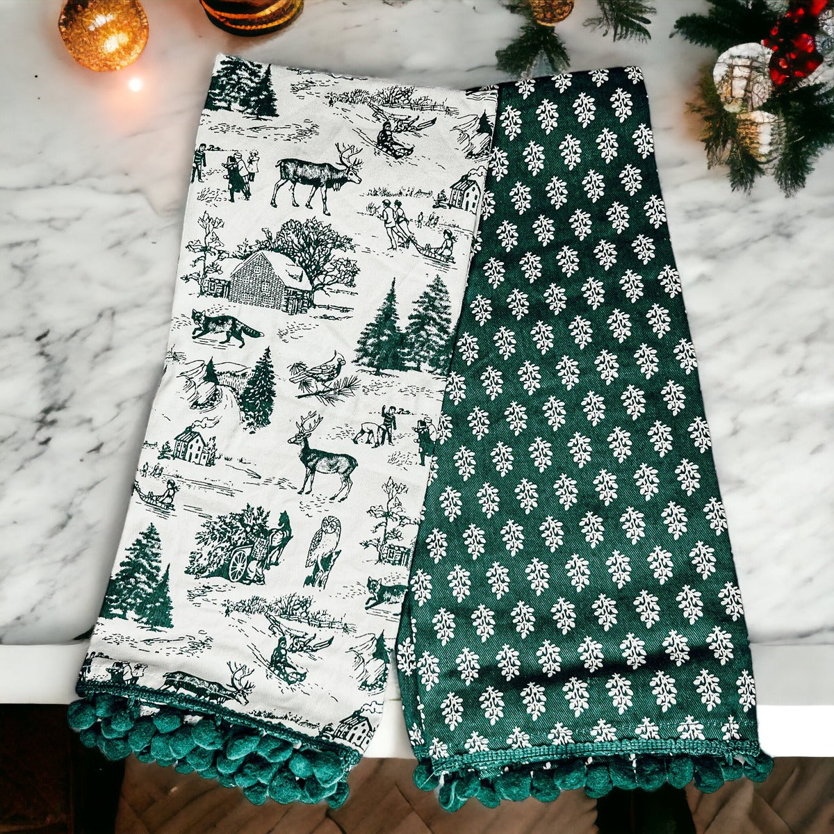 Set of two forest green dish towels with Christmas design, showcasing a classic forest pattern on durable cotton fabric.