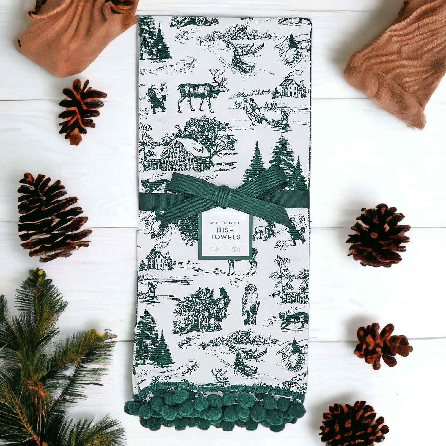 Set of two forest green dish towels with Christmas design, showcasing a classic forest pattern on durable cotton fabric.