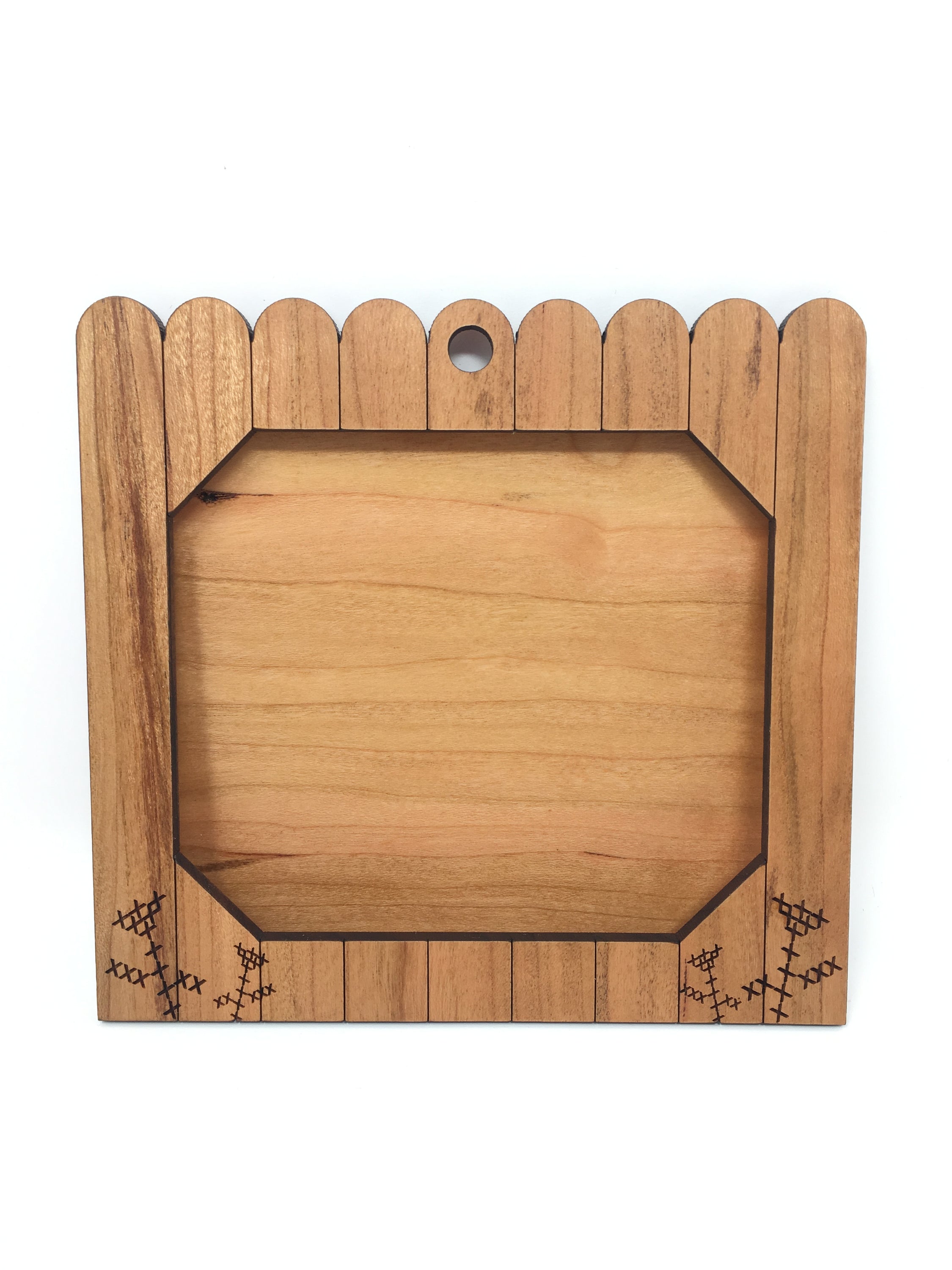 A beautifully crafted garden gate ornament frame made from Alder hardwood, showcasing its intricate laser-cut design and natural finish.