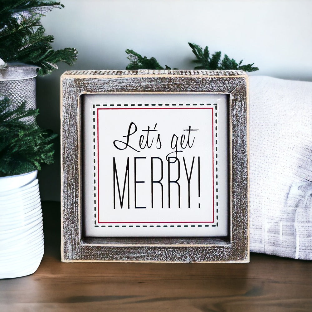 Get Merry 5" Sign featuring a wooden frame and metal embossed lettering with a red border, perfect for holiday decor.