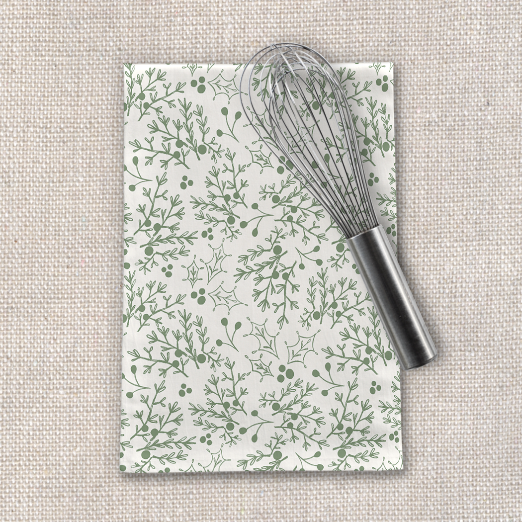 A festive Green Christmas Branch Tea Towel made of cotton twill, featuring a charming green branch design, perfect for holiday kitchen decor.