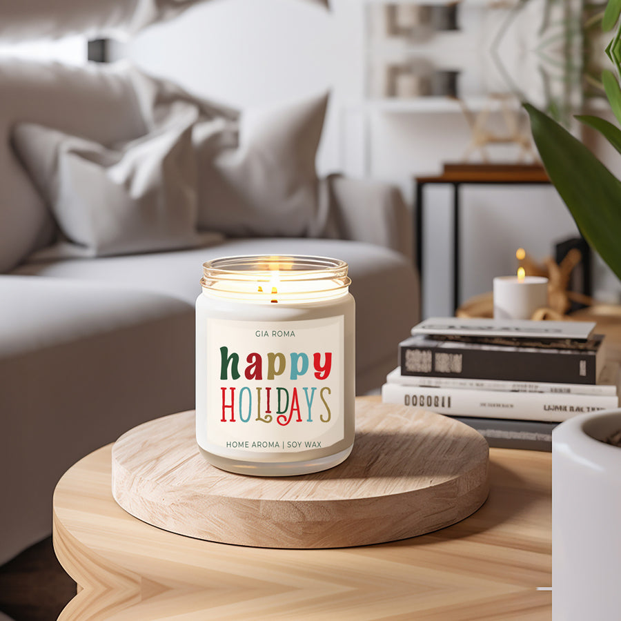 Happy Holiday Candle in a 9oz jar with festive scents of pine, orange, and woods, perfect for creating a cozy holiday atmosphere.