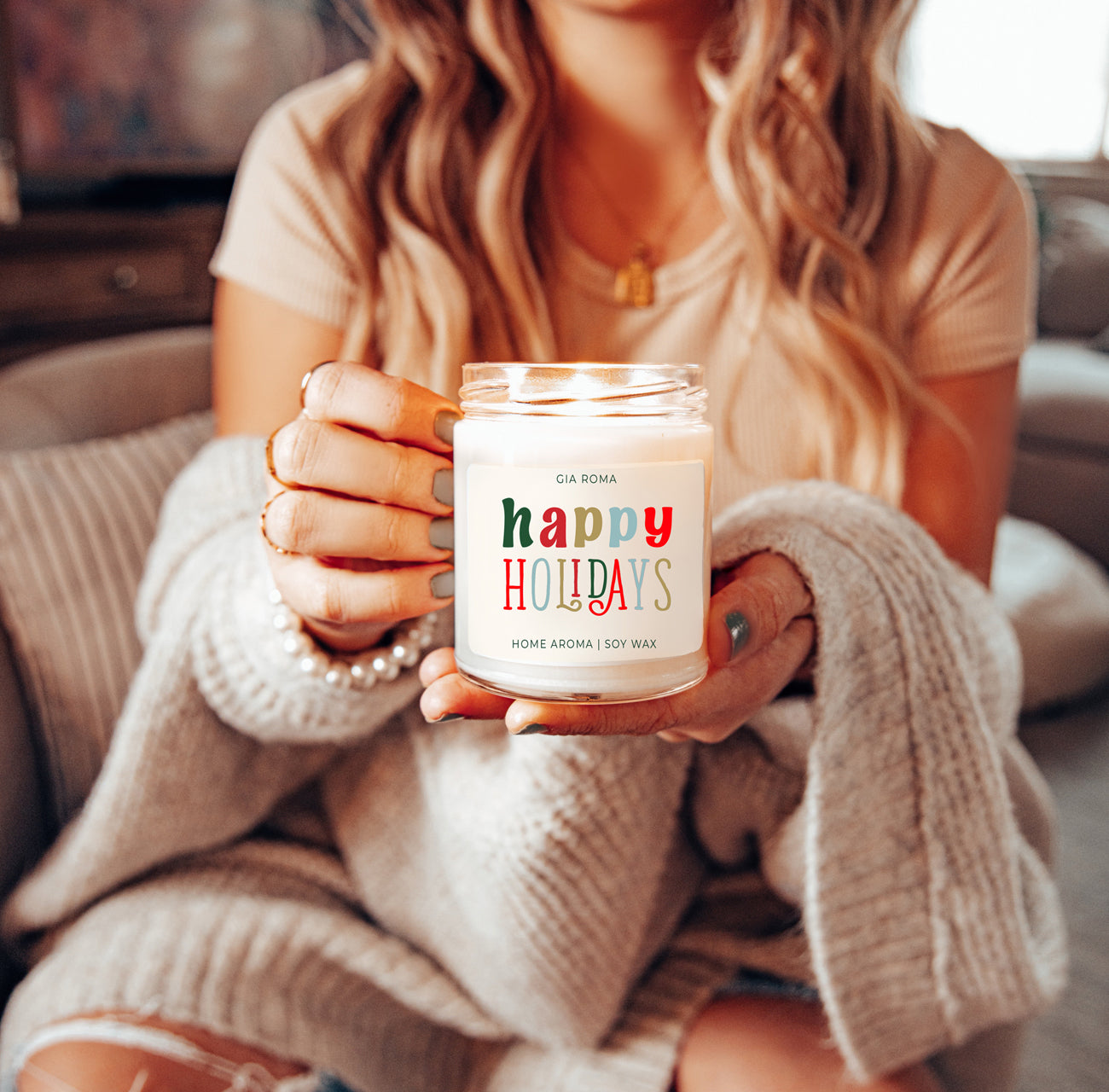 Happy Holiday Candle in a 9oz jar with festive scents of pine, orange, and woods, perfect for creating a cozy holiday atmosphere.