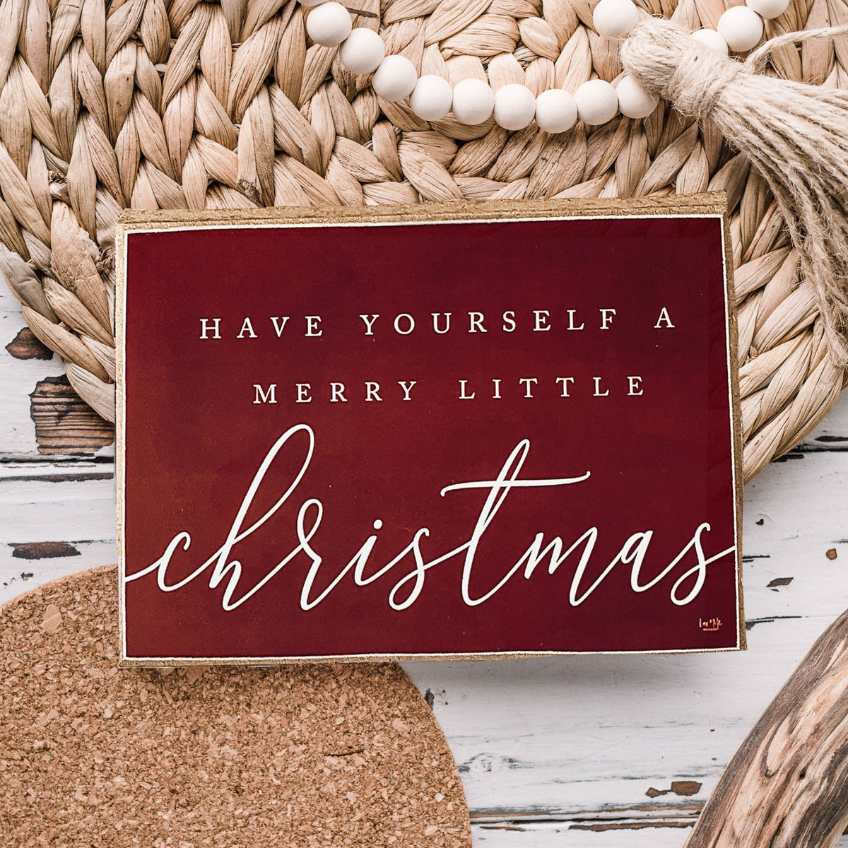 Wooden block sign with red background and white text reading 'Have Yourself a Merry Little Christmas', perfect for holiday decor.