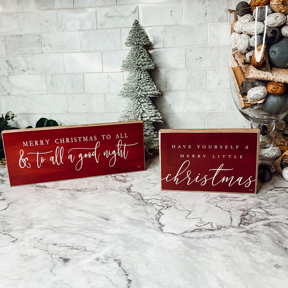 Wooden block sign with red background and white text reading 'Have Yourself a Merry Little Christmas', perfect for holiday decor.