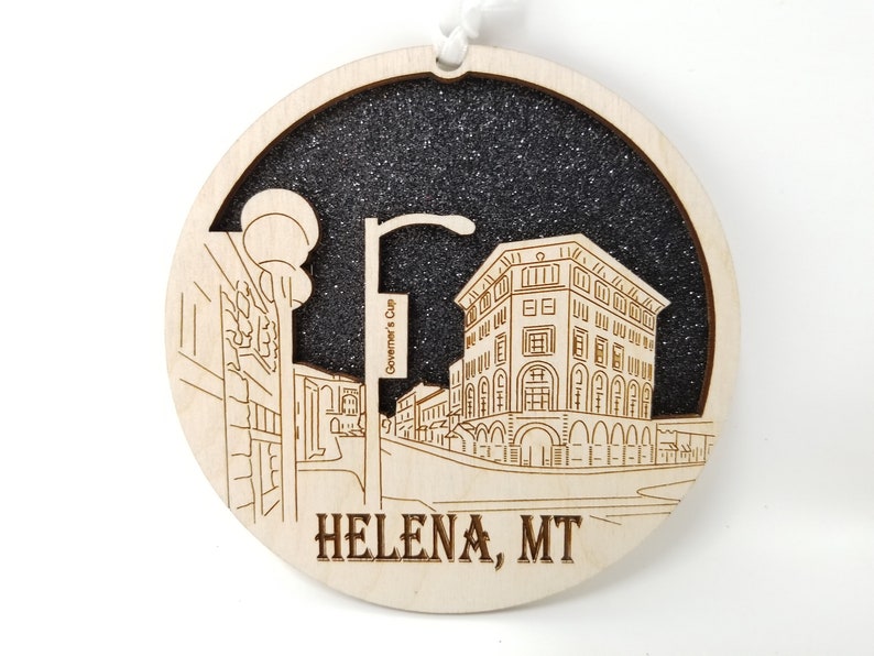 Helena Skyline Ornament made from premium Baltic birch wood, showcasing a detailed city skyline design.