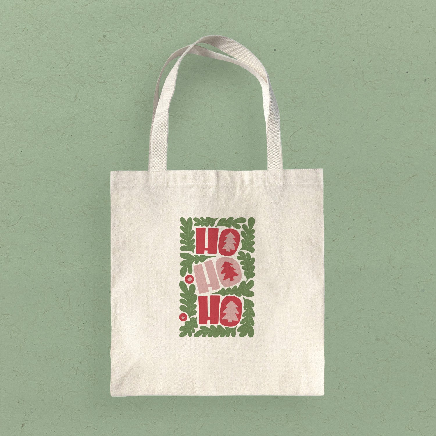 Ho Ho Ho Canvas Tote Bag featuring a festive design, made from durable heavy-duty canvas with reinforced straps.