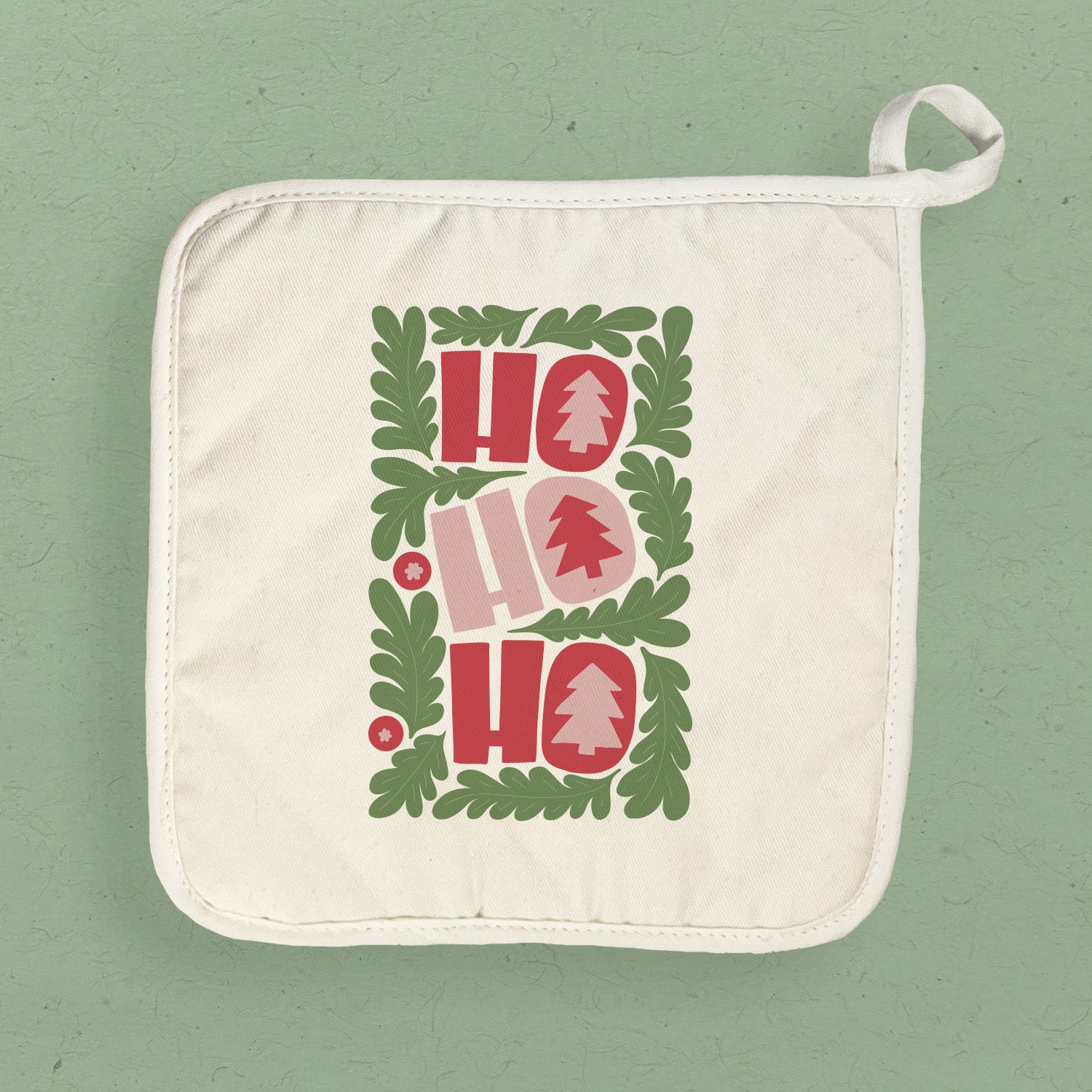 A festive Ho Ho Ho Cotton Pot Holder featuring vibrant holiday designs, made from durable cotton and terry cloth, perfect for protecting surfaces.