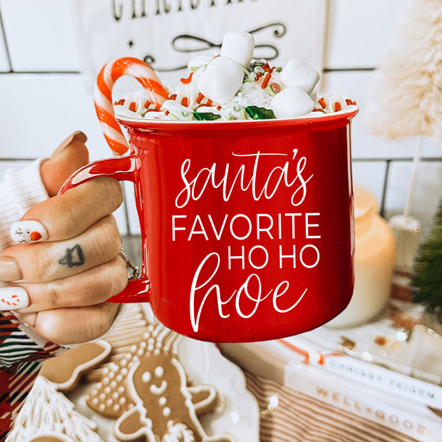 Festive Ho Ho Hoe Mug in red and green ceramic with white lettering, perfect for holiday beverages.