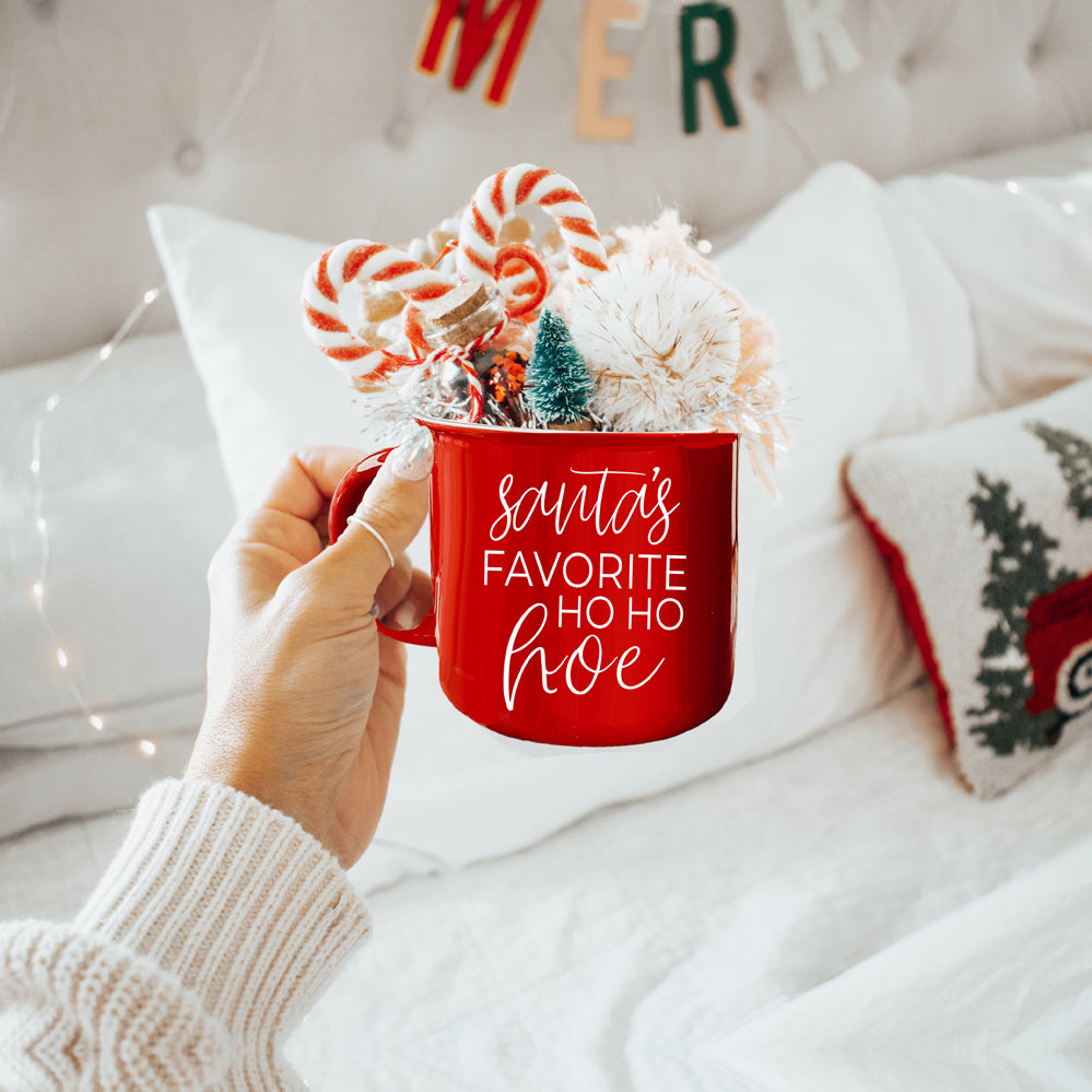 Festive Ho Ho Hoe Mug in red and green ceramic with white lettering, perfect for holiday beverages.