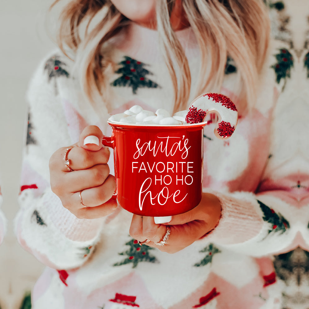 Festive Ho Ho Hoe Mug in red and green ceramic with white lettering, perfect for holiday beverages.