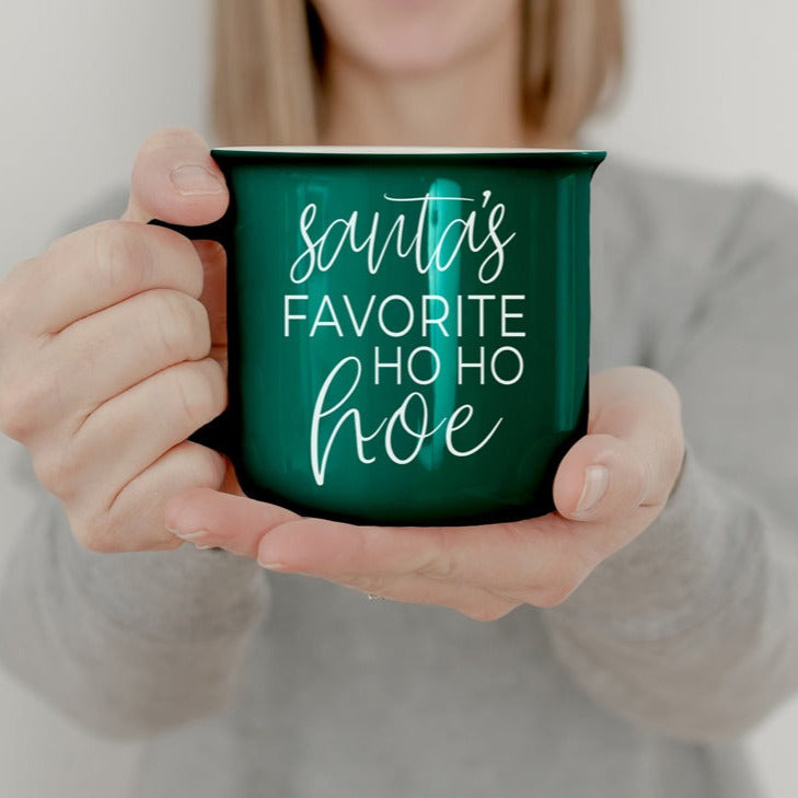 Festive Ho Ho Hoe Mug in red and green ceramic with white lettering, perfect for holiday beverages.