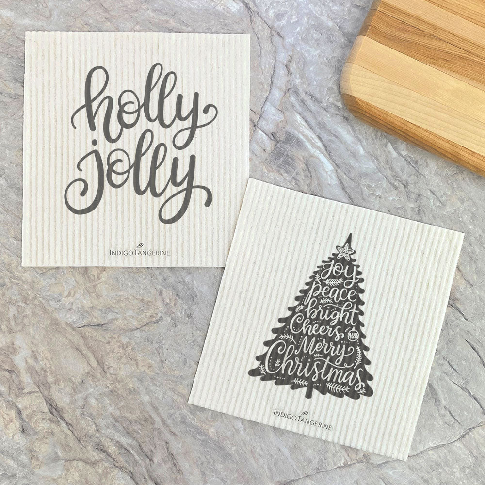 Two eco-friendly Swedish dishcloths featuring festive Christmas tree designs, made from plant-based fibers.