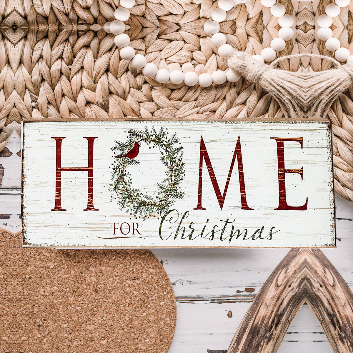 A beautifully crafted Home for Christmas Sign made of thick wood, featuring a festive wreath design on the letter 'O'.