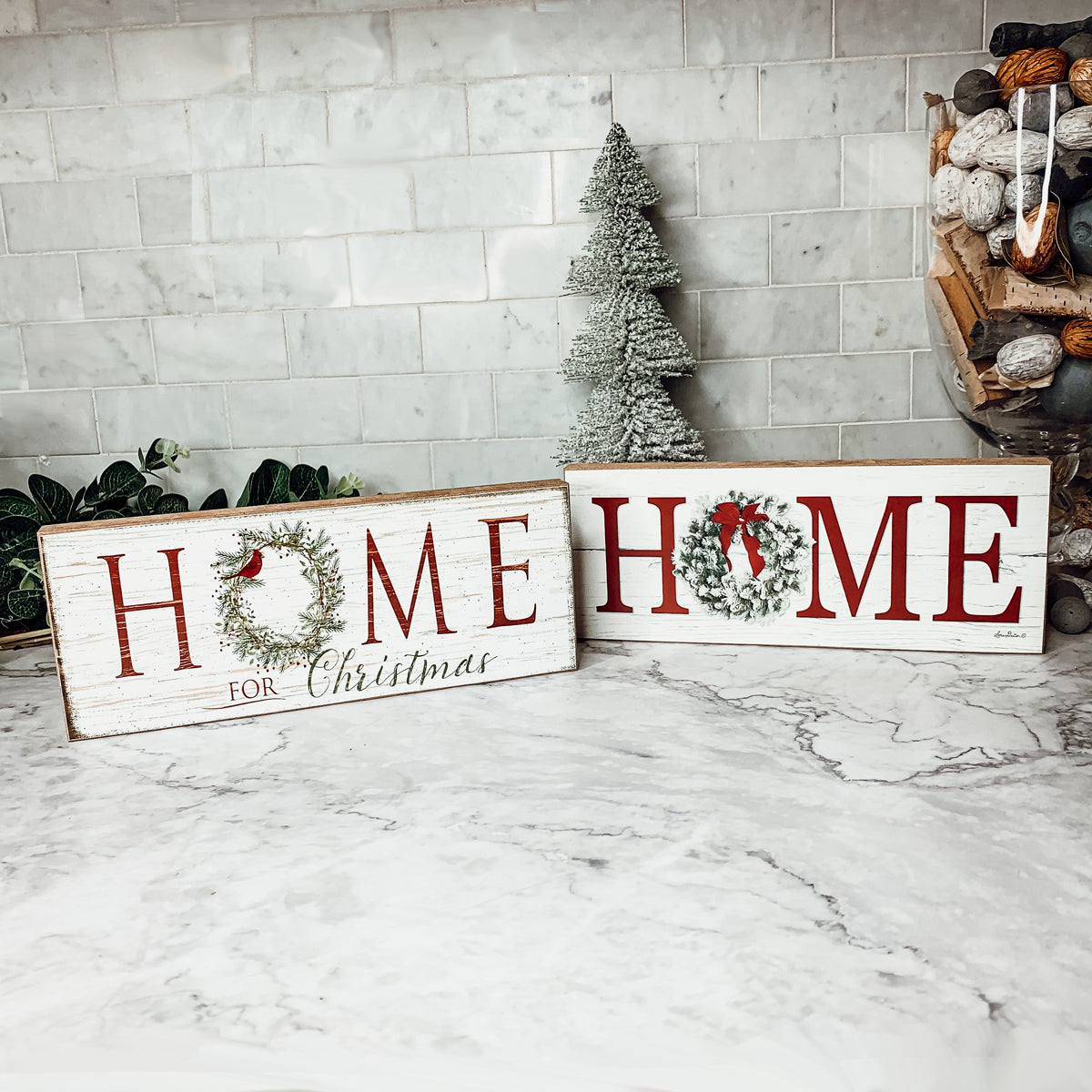 A beautifully crafted Home for Christmas Sign made of thick wood, featuring a festive wreath design on the letter 'O'.