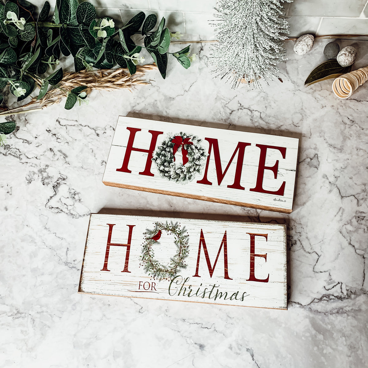 A beautifully crafted Home for Christmas Sign made of thick wood, featuring a festive wreath design on the letter 'O'.