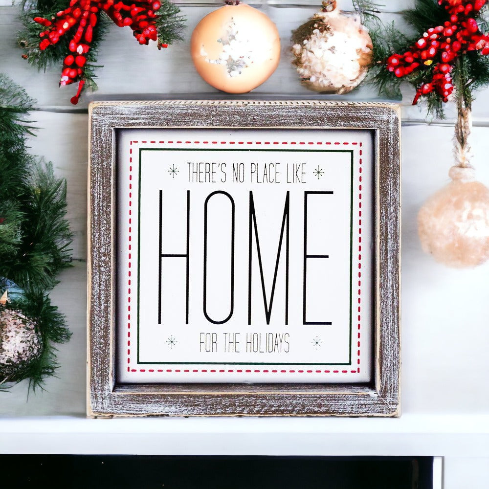 A stylish 7-inch framed sign that reads 'There's No Place Like Home for the Holidays' with a wooden frame and metal accents.