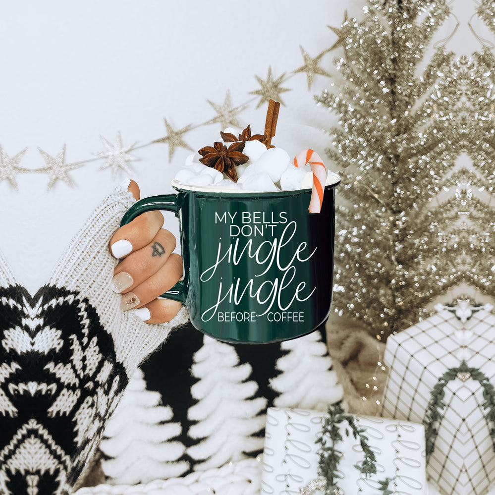 A festive Jingle Jingle Mug in red and green ceramic, featuring white lettering and a campfire style design, perfect for coffee lovers.