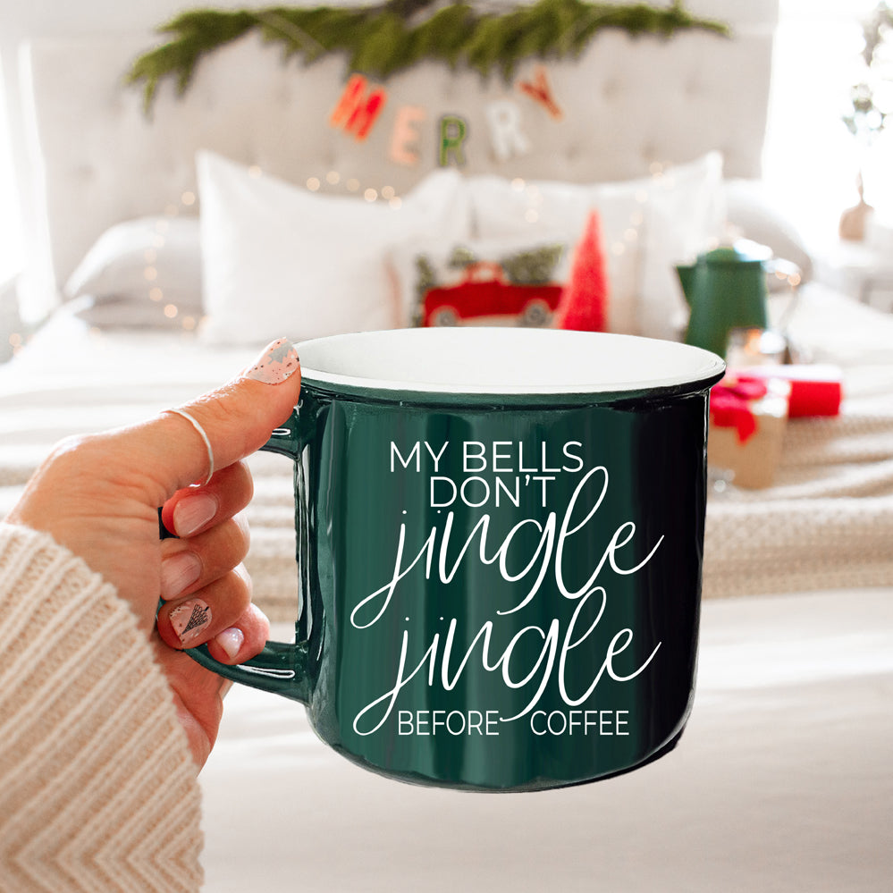 A festive Jingle Jingle Mug in red and green ceramic, featuring white lettering and a campfire style design, perfect for coffee lovers.