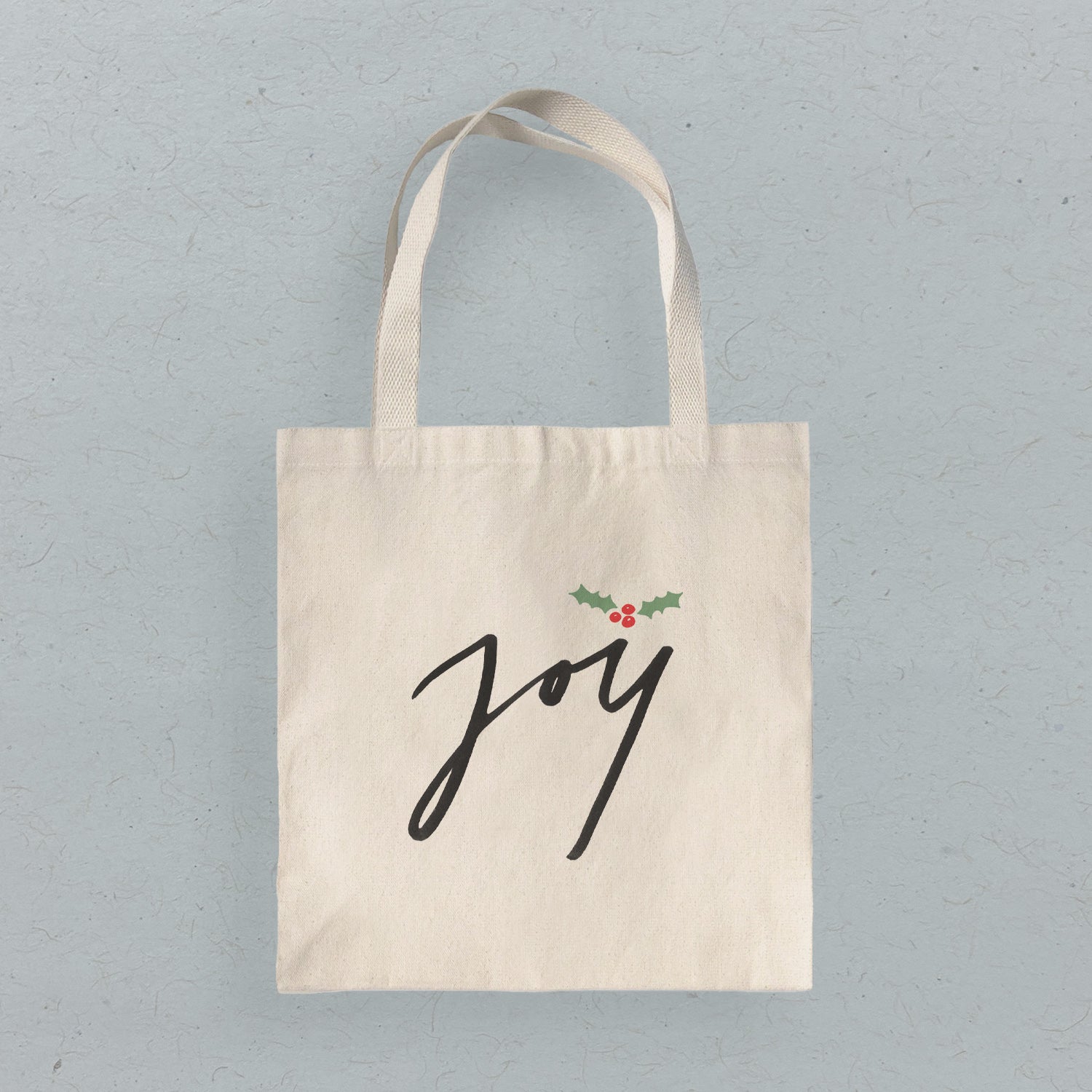 Joy Canvas Tote Bag featuring vibrant eco-friendly prints on heavy-duty fabric, ideal for shopping and daily use.