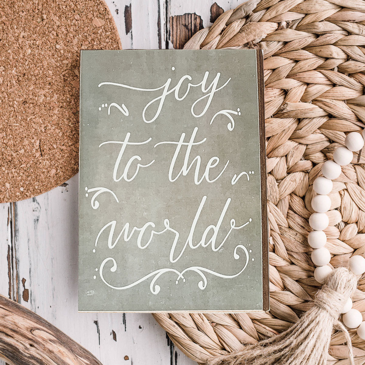 Joy To The World Sign with light gray textured background and festive text about Christmas trees and drinks.