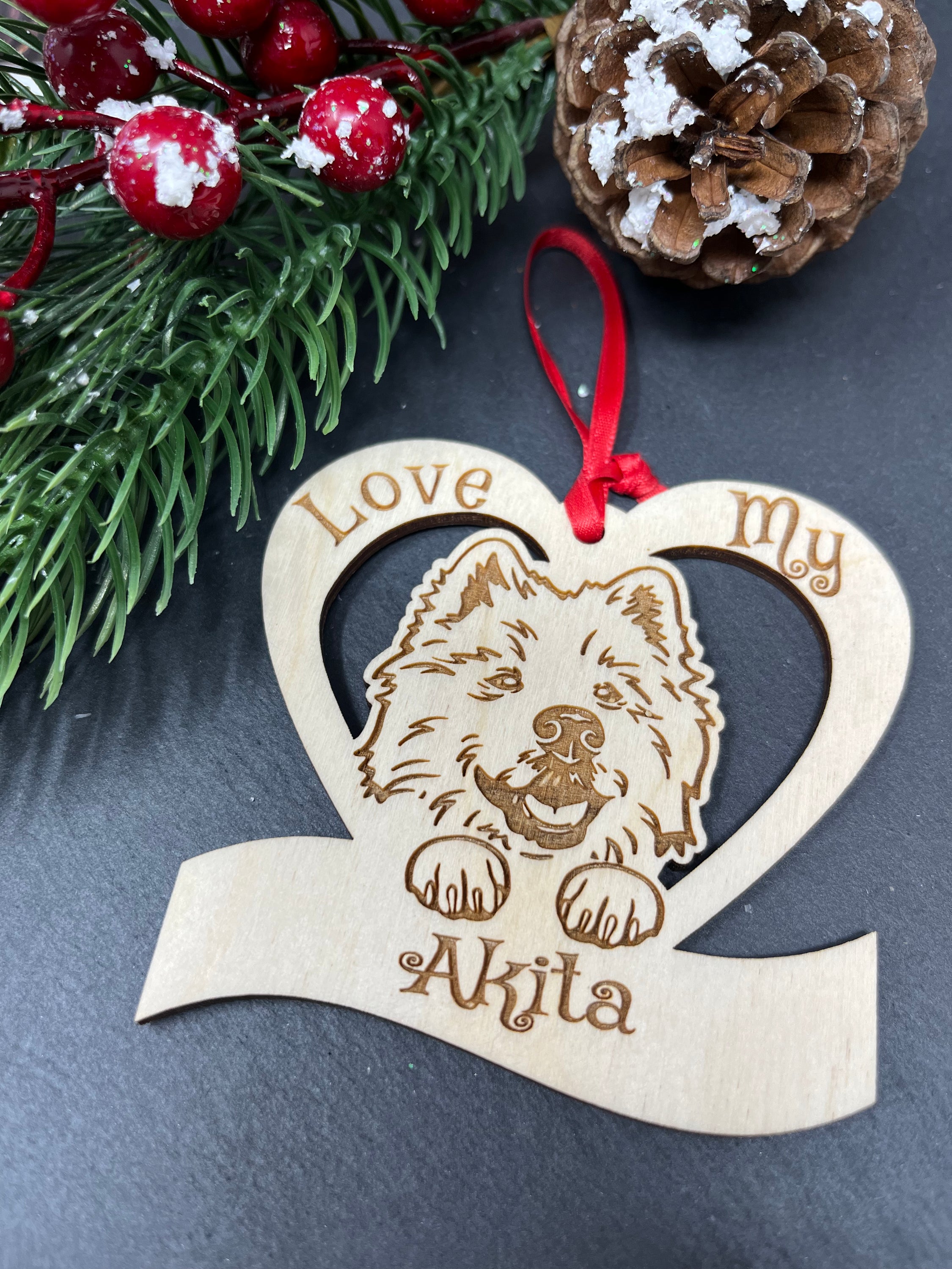 Love My Akita ornament made from laser engraved Baltic Birch wood, featuring a unique design celebrating Akitas, ready to hang with ribbon.