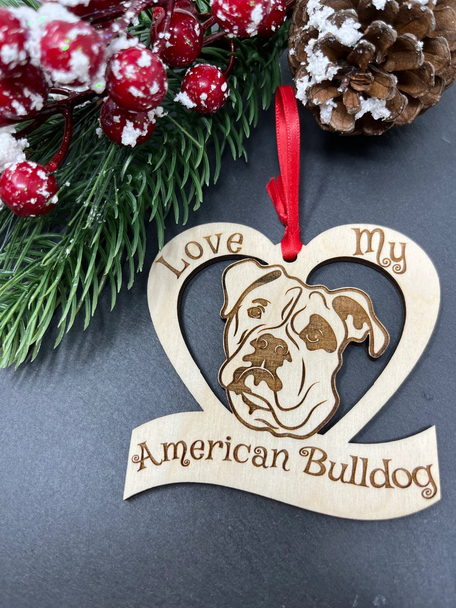 Laser engraved wooden ornament featuring an American Bulldog design, perfect for Christmas decoration.