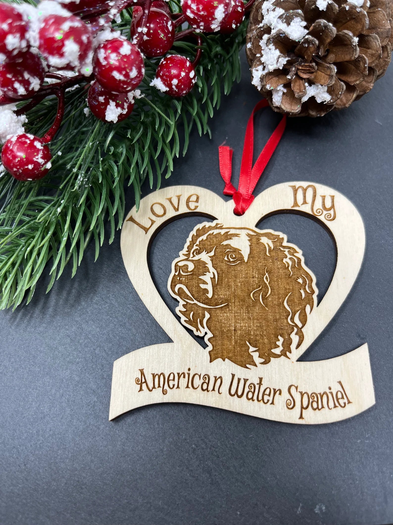 Laser engraved wooden ornament featuring an American Water Spaniel, perfect for Christmas decoration.