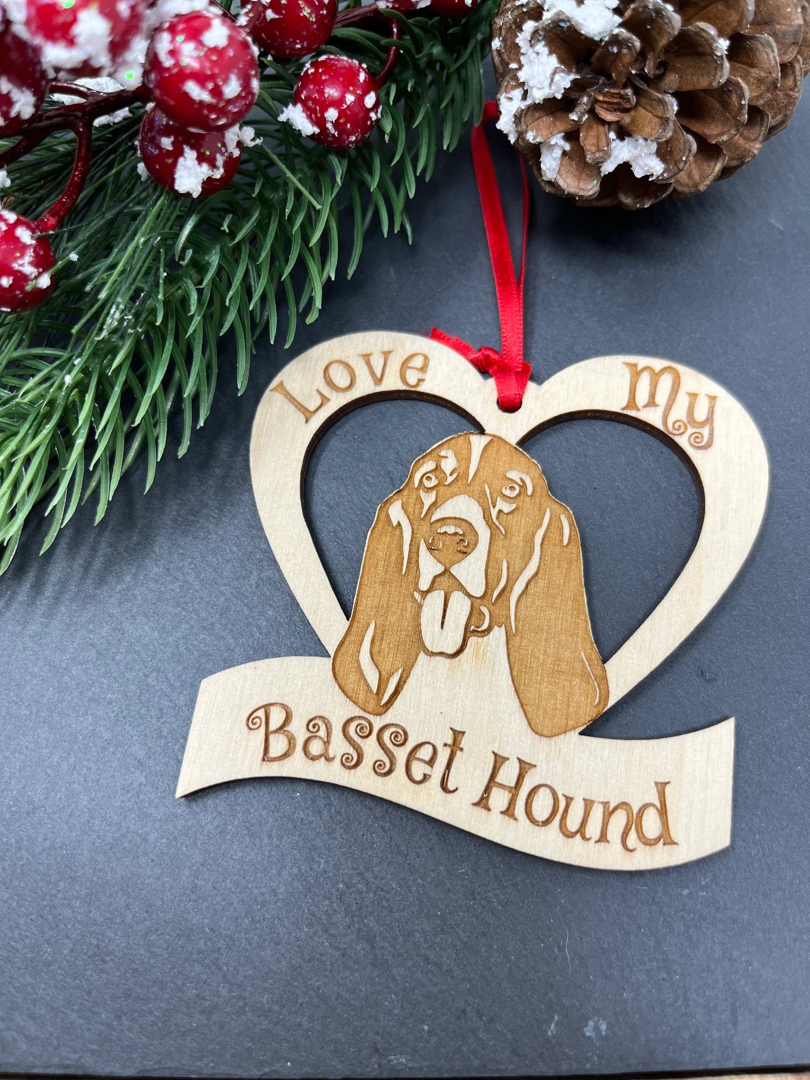 Laser engraved wooden ornament featuring a Basset Hound, perfect for Christmas decoration.