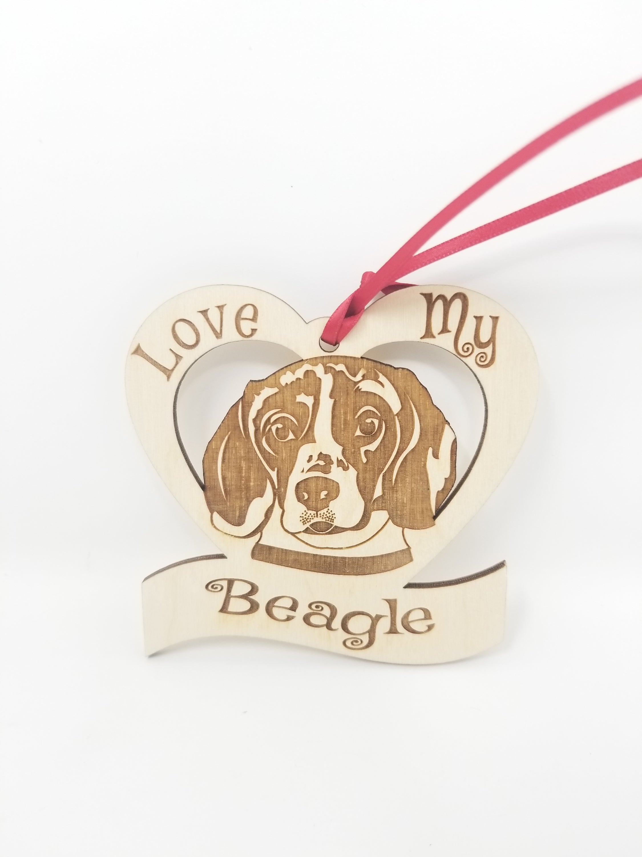 Laser engraved wooden ornament featuring a beagle design, perfect for Christmas decoration.