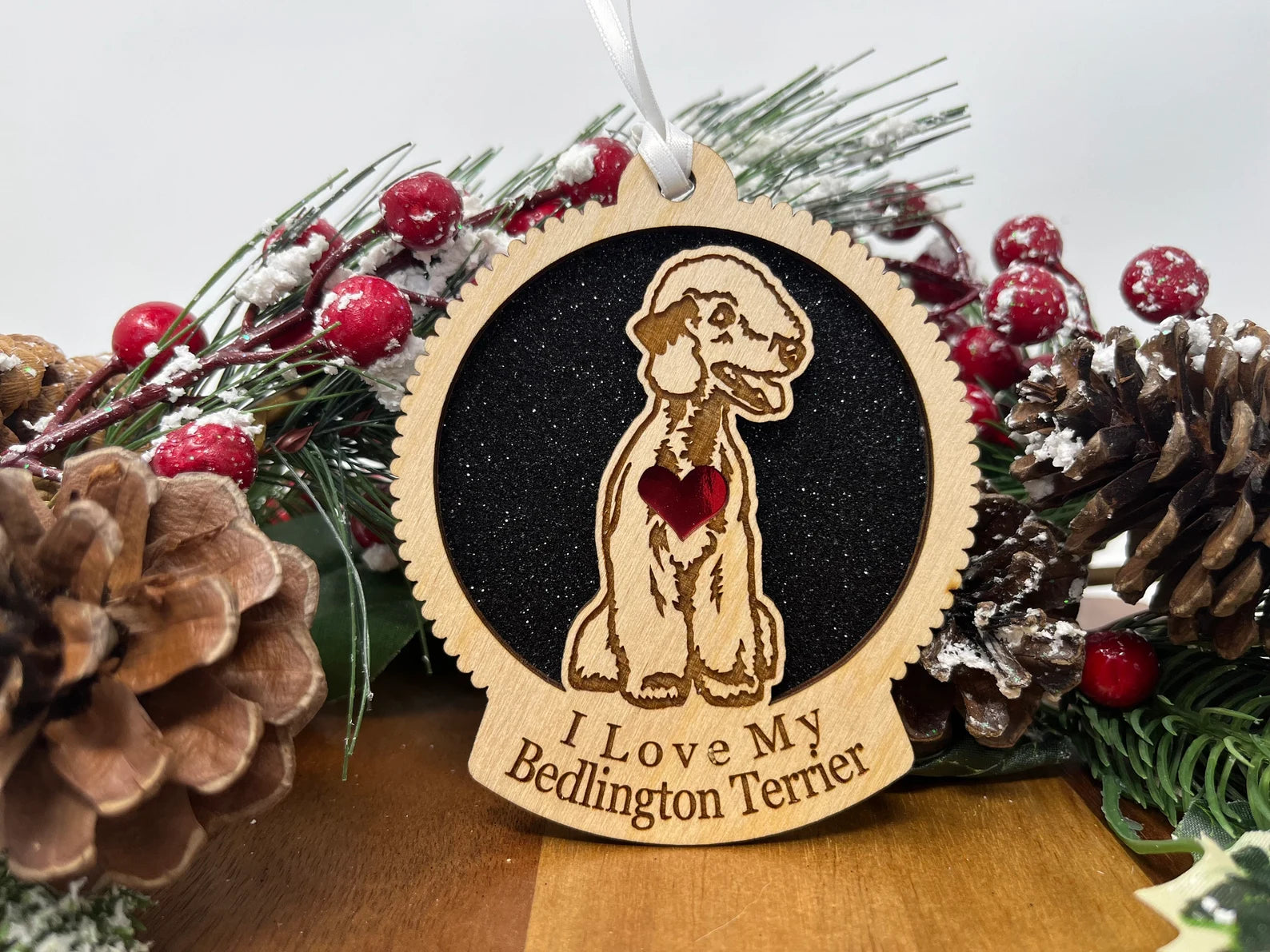 A beautifully crafted wooden ornament featuring a Bedlington Terrier silhouette, perfect for Christmas or as a collectible decoration.