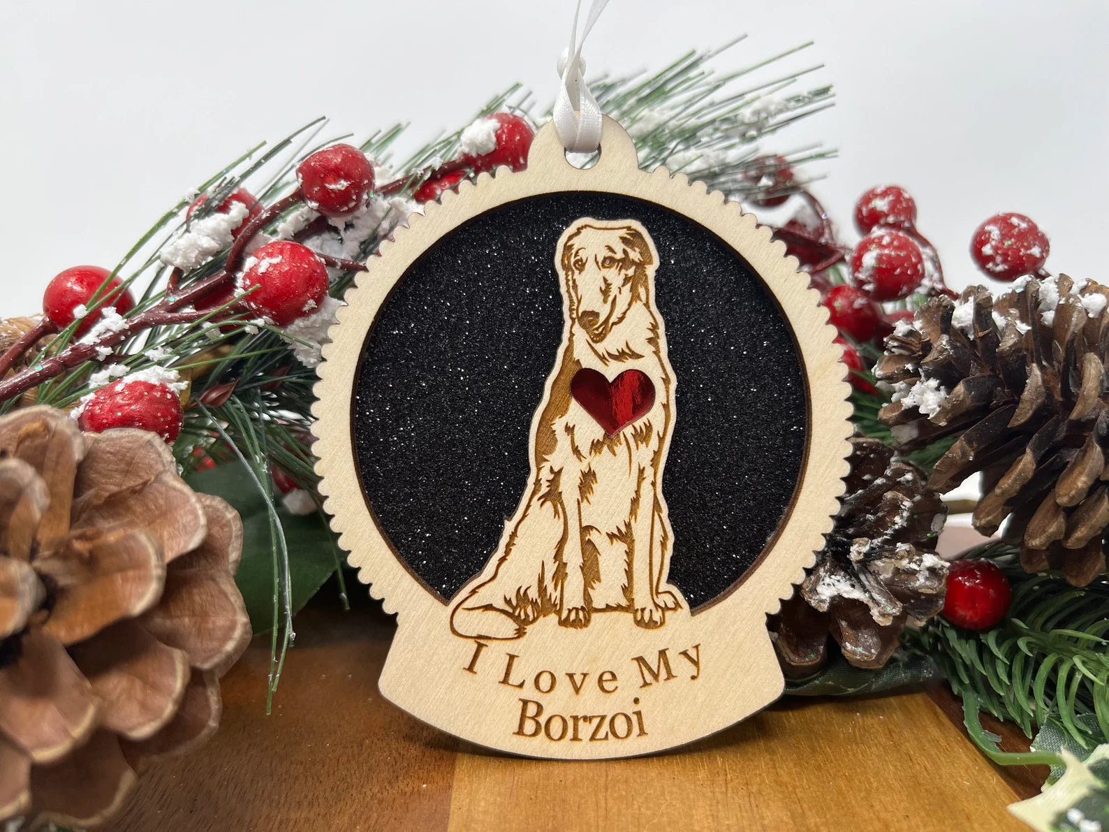 Beautiful laser-cut wooden ornament featuring a Borzoi silhouette, perfect for Christmas decoration.