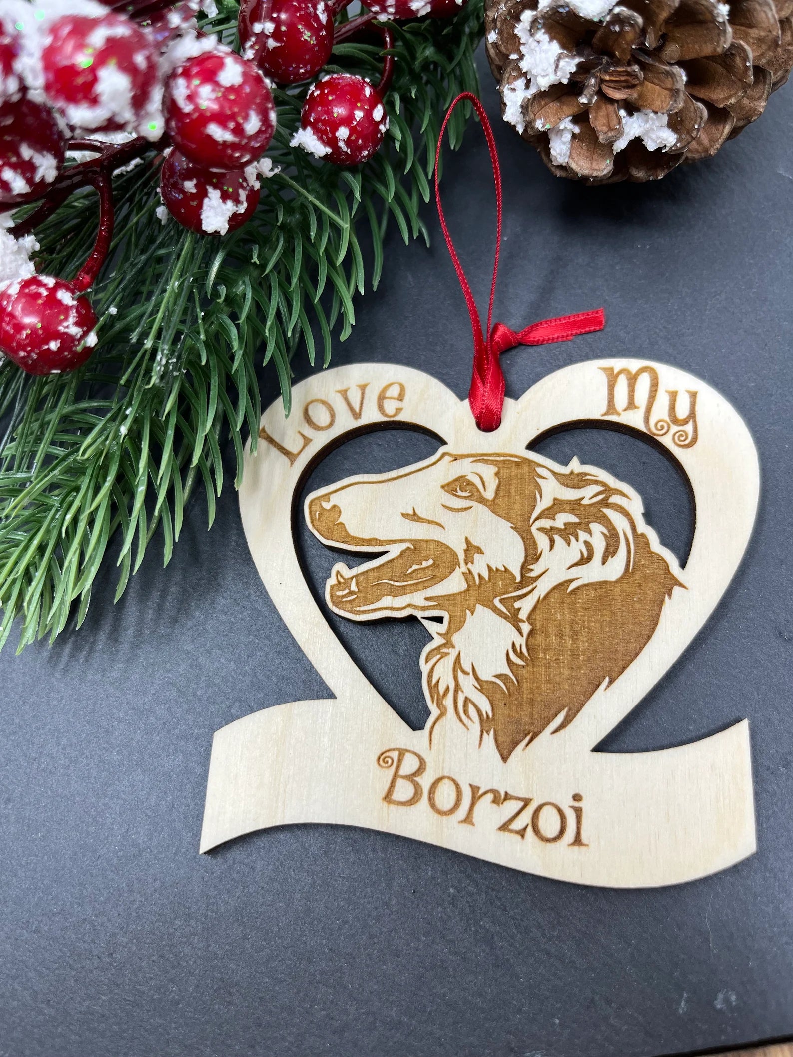 A beautifully laser engraved wooden ornament featuring a Borzoi dog, perfect for Christmas decorations.