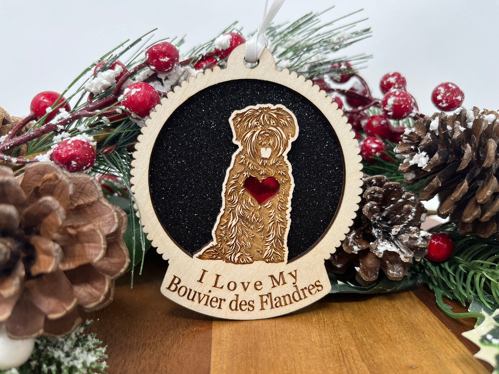 A beautifully crafted laser cut wooden ornament featuring the silhouette of a Bouvier Des Flandres, perfect for holiday decor.