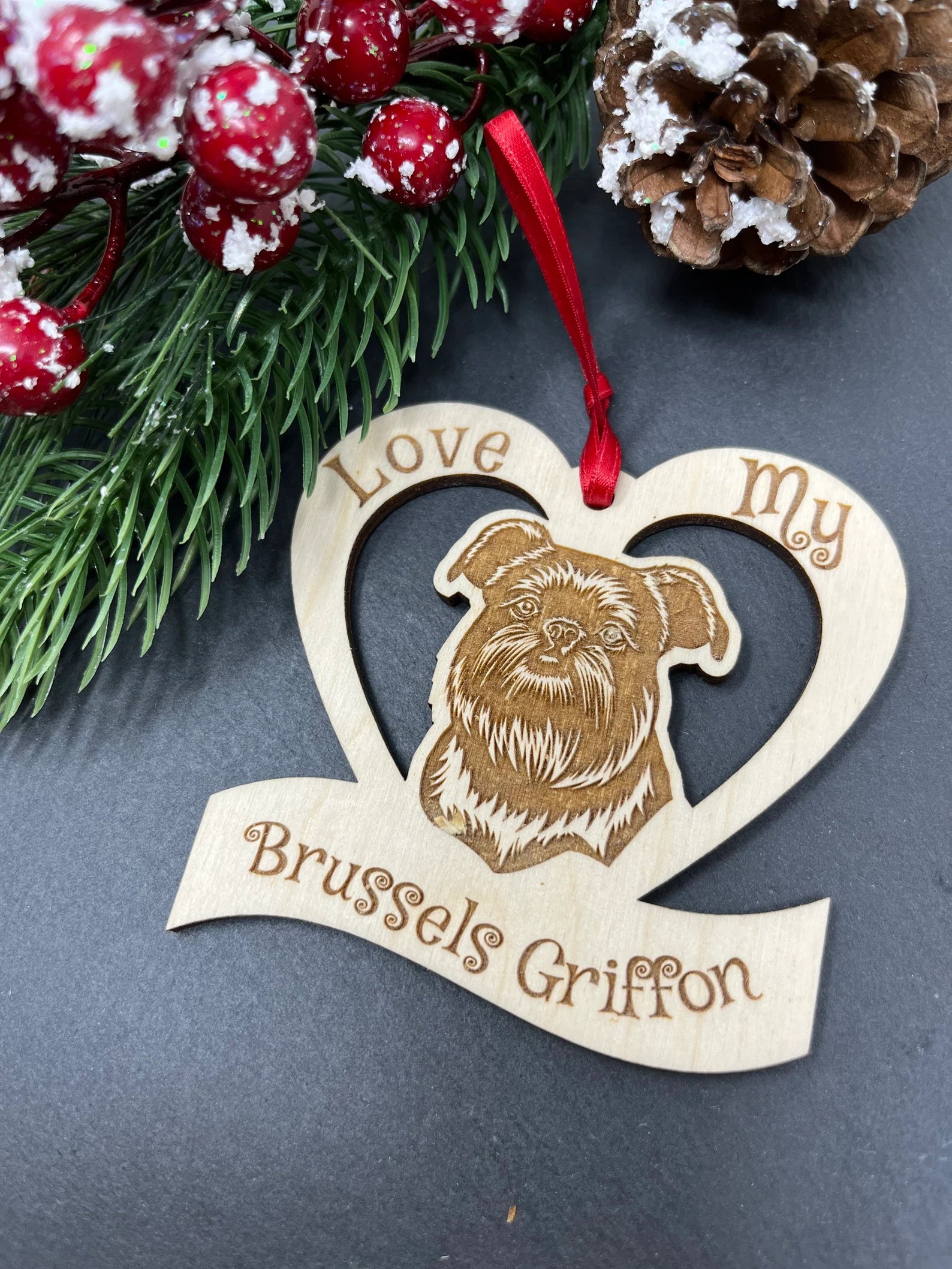 Laser engraved wooden ornament featuring a Brussels Griffon, perfect for Christmas decoration.