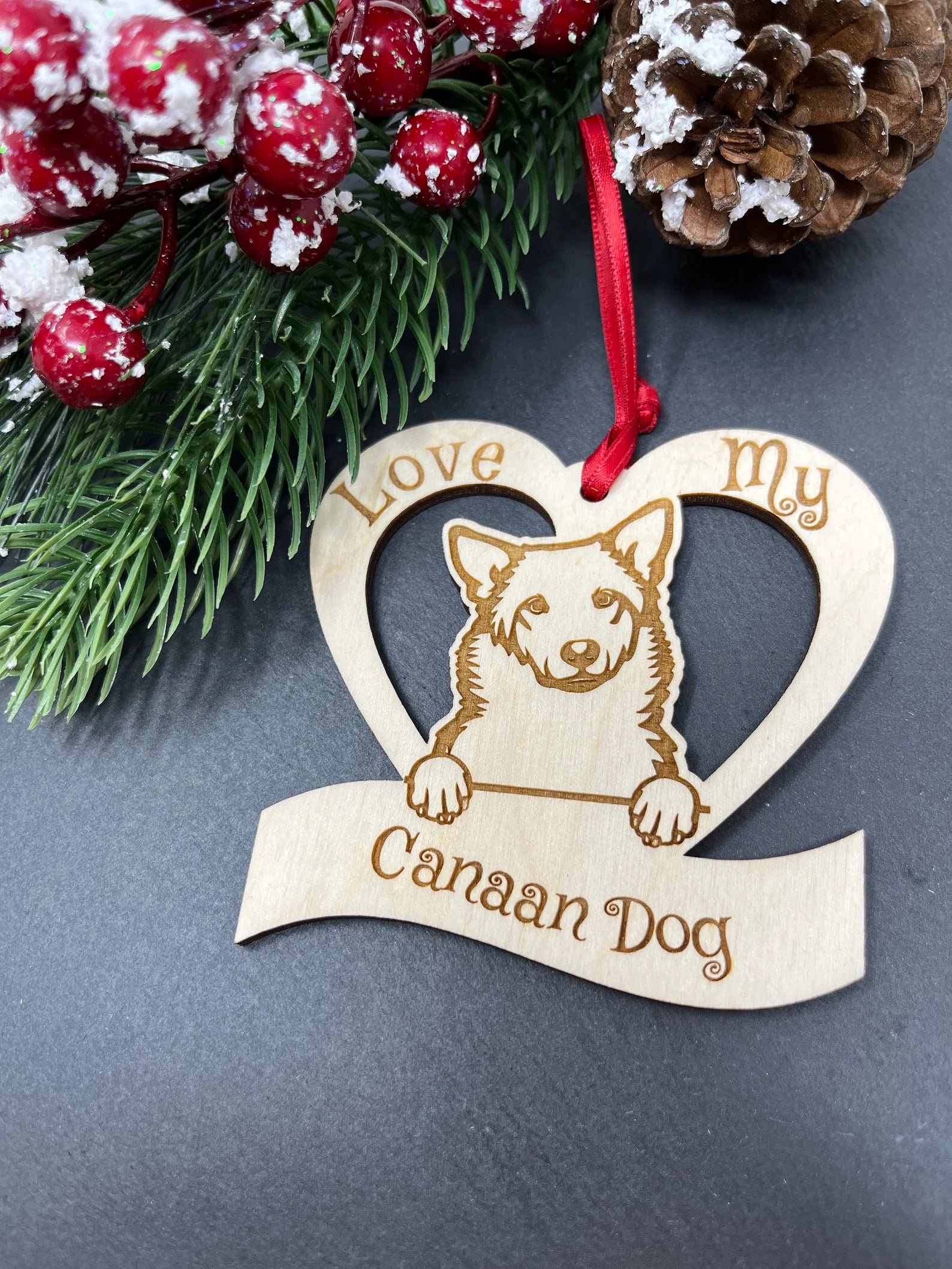 Love My Canaan ornament made of laser engraved Baltic Birch wood, featuring a unique design celebrating dogs, perfect for Christmas decoration.