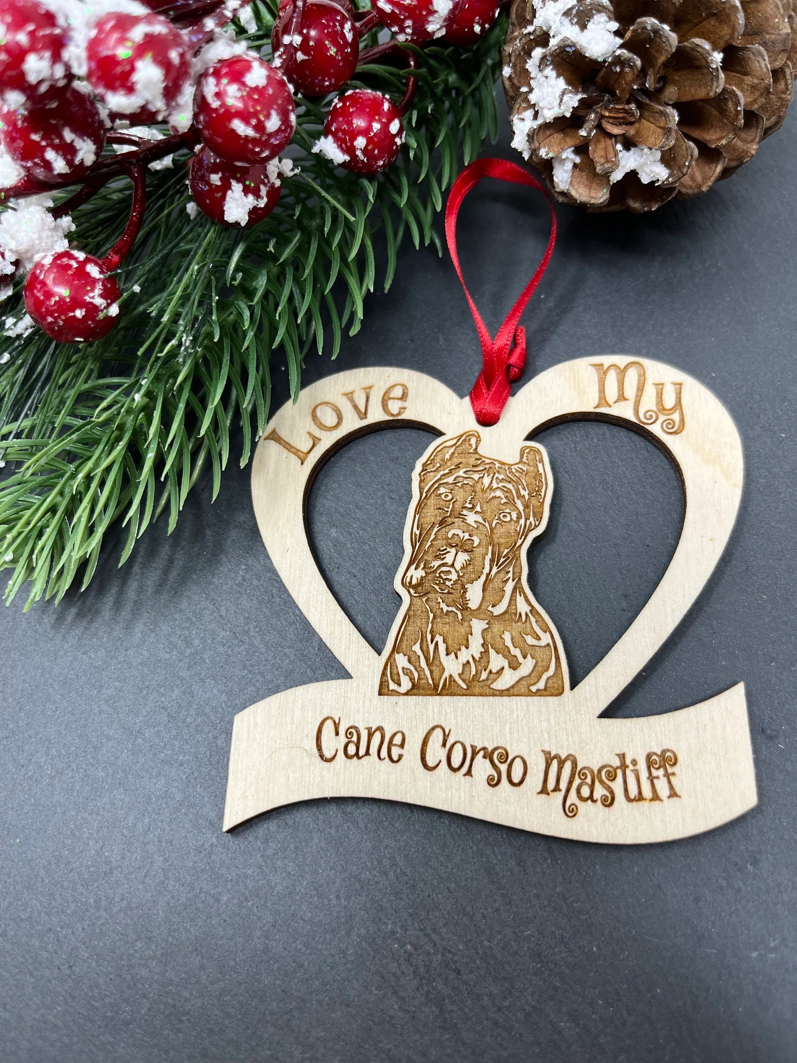 Laser engraved wooden ornament featuring a Cane Corso Mastiff, perfect for Christmas decoration.