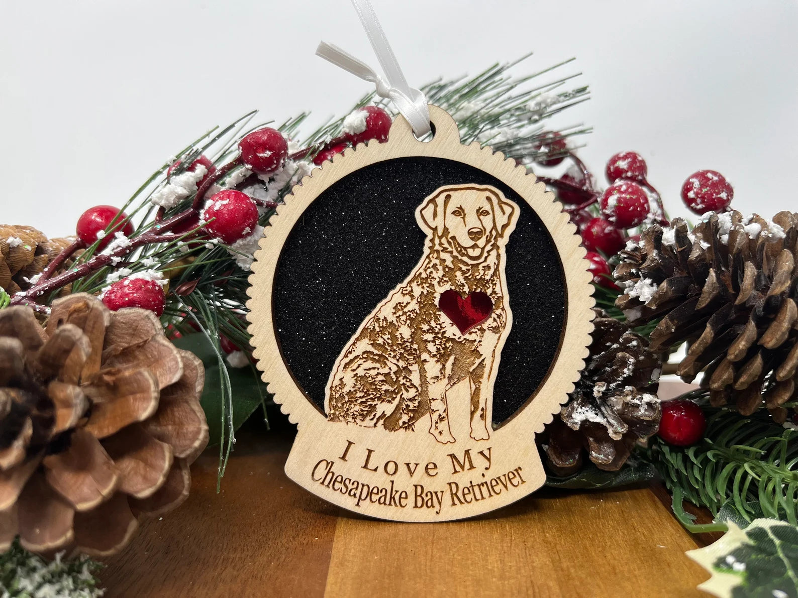 Laser cut wooden ornament featuring a Chesapeake Bay Retriever silhouette, perfect for Christmas decoration.