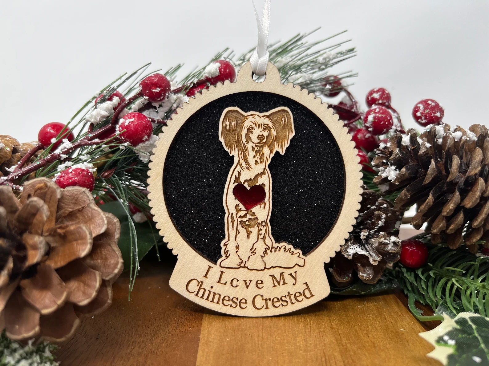 Laser cut wooden ornament featuring a Chinese Crested dog silhouette, perfect for Christmas decoration.