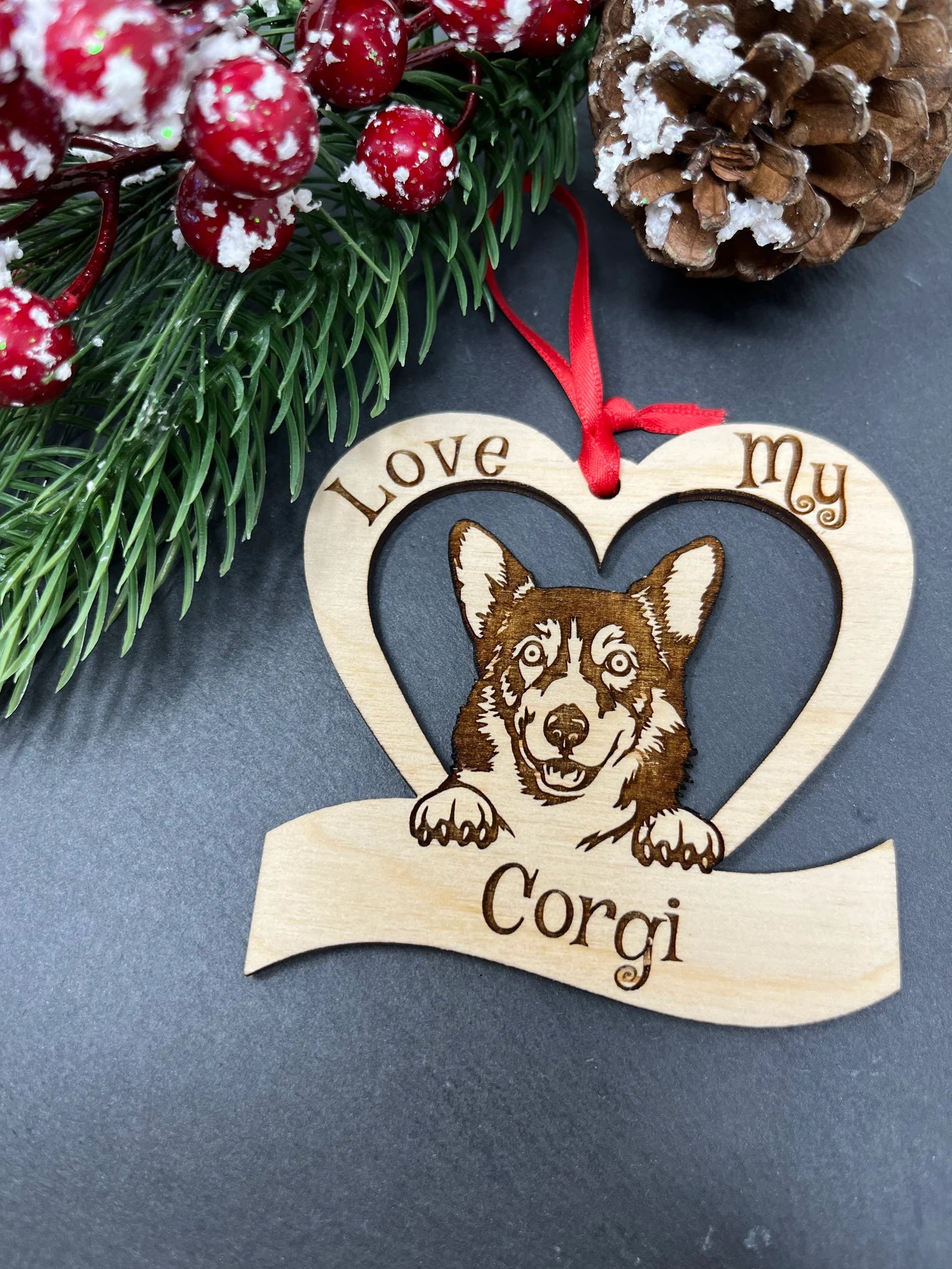 Laser engraved wooden ornament featuring a corgi design, perfect for Christmas decoration.