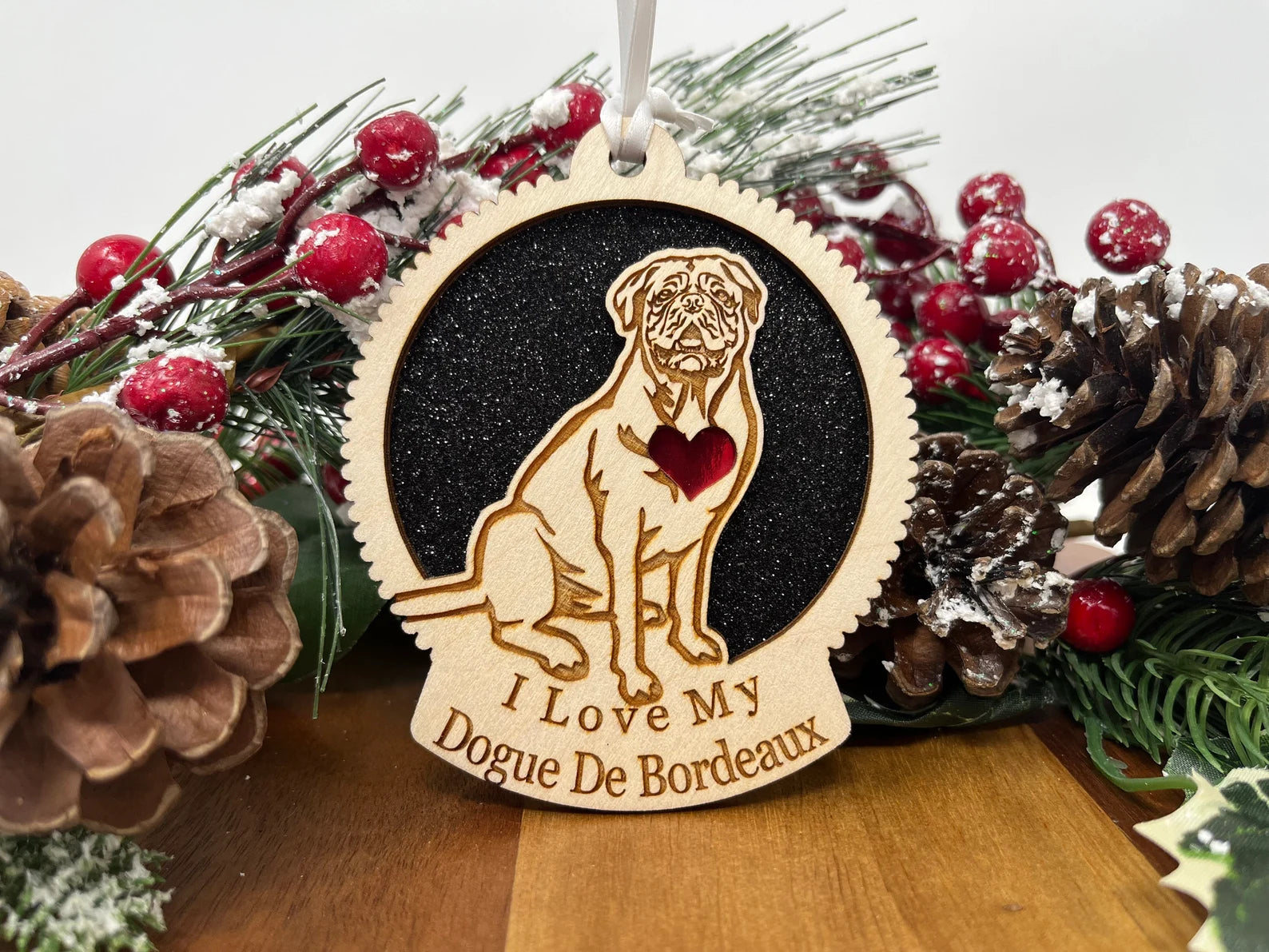 A beautifully crafted laser cut wooden ornament featuring a Dogue De Bordeaux silhouette, perfect for Christmas decoration.